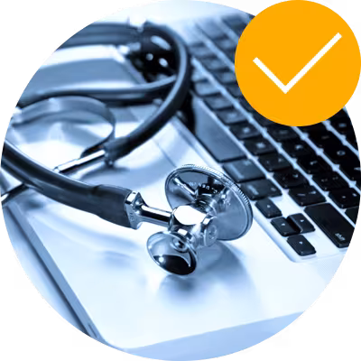 Laptop with a shiny stethoscope on top of it